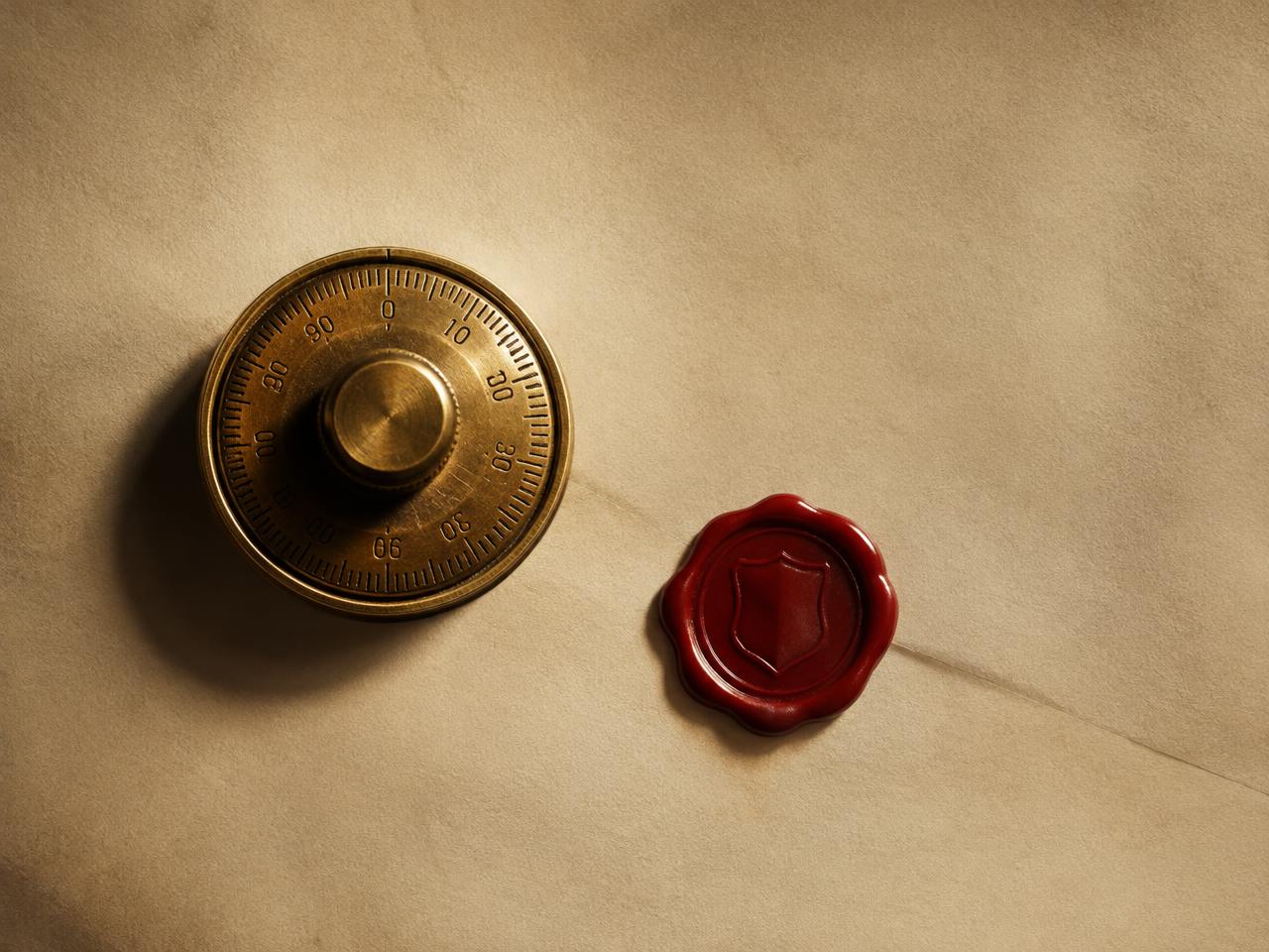 Brass vault dial and oxblood wax seal on bone paper